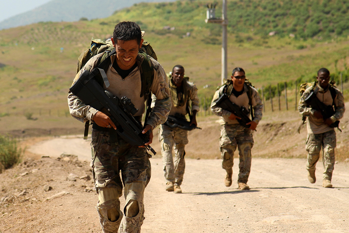 A member of Team Belize strides ahead of the pack during a ruck march event in Santiago de Tuna, Peru as part of Fuerzas Comando 2016, May 9. This is just one of the many tests the special operations members faced during the competition. (U.S. Army photo by Jaccob Hearn/released)